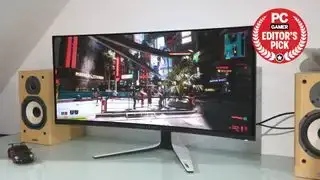 Φωτογραφία του Alienware AW3423DW σε ένα γραφείο.