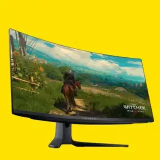 Màn hình Alienware trên nền màu vàng.