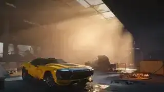 Cyberpunk 2077 Nomad Lifepath – Eine Garage voller Autos im staubigen Sonnenlicht