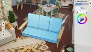 Los Sims 5, Proyecto René en desarrollo: captura de pantalla de un sofá azul con un panel de rueda de colores abierto.