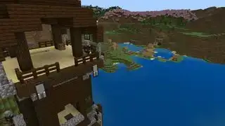 Minecraft tohumları - göldeki yağmacı karakolu, yakındaki bir köye uğursuz bir şekilde bakıyor