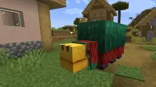 Minecraft 1.20 - Snuffelbende met zijn grote gele snuit en bemoste groene rug staat in een dorp en lijkt bijna net zo groot als een dorpeling.