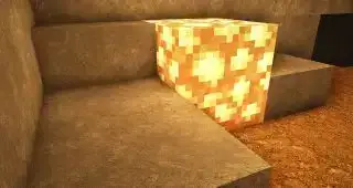 Minecraft-textuurpakketten - Een gloeisteen verlicht HD-steen- en vuiltexturen eromheen.